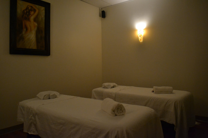 J-Massage room with double massage tables and painting